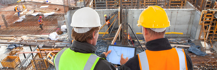 two men looking over a construction project and questioning what Darren is doing